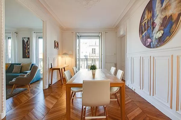 chic dining set for six with accessto the living area in a 2-bedroom paris luxury apartment