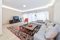 living area illuminated by the large French windows