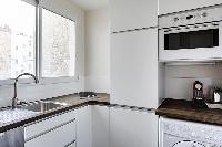 modern kitchen appliances in Trocadero - Poincare luxury apartment