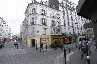street below the in 2-bedroom Paris luxury apartment