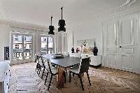elegant 8-seater dining area in black and white hues in Paris luxury apartment
