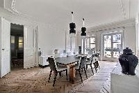 elegant 8-seater dining area in black and white hues in Paris luxury apartment