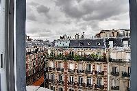 street view from the window of a 2-bedroom Paris luxury apartment