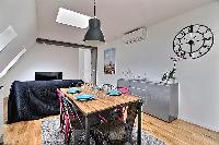 chic six-seater dining set  in a 2-bedroom Paris luxury apartment