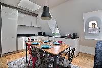 chic six-seater dining set  in a 2-bedroom Paris luxury apartment