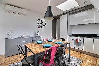 chic six-seater dining set  in a 2-bedroom Paris luxury apartment