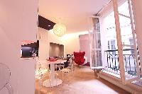 dining area with a four-seater dining table in a 2-bedroom Paris luxury apartment