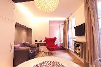 chic dining area, kitchen, and living area  in a 2-bedroom Paris luxury apartment