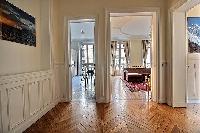 kitchen and living area in a 3-bedroom Paris luxury apartment