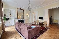 3-bedroom Paris luxury apartment tastefully decorated interiors with its original wooden floors