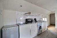 space-efficient kitchen in a 2-bedroom Paris luxury apartment