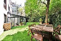 extravagant 2-bedroom paris luxury apartment boasts a beautiful and well-maintained backyard