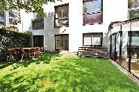 lovely courtyard with table and chairs in paris luxury apartment