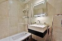 shower area and sink in paris luxury apartment