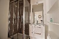 bathroom with sink and shower in Paris luxury apartment