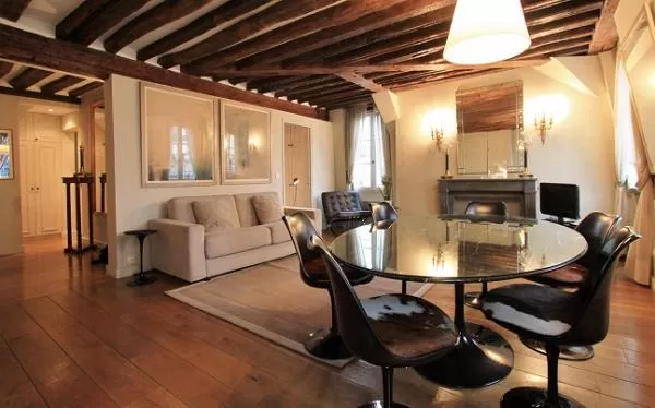 elegant 2-bedroom Paris luxury apartment with its original exposed ceiling beams and wooden floors