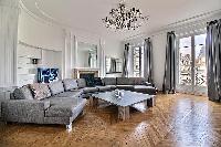 elegant living room and balcony of Trocadero - Georges Mandel luxury apartment