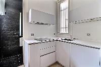 fully equipped semi-separated kitchen in a 2-bedroom Paris luxury apartment