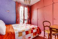 bright-colored bedroom of Mouffetard - Carmes luxury apartment
