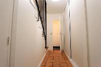 hallway and stairs in a 3-bedroom Paris luxury apartment