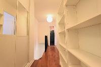 hallway, shelves and stairs in a 3-bedroom Paris luxury apartment