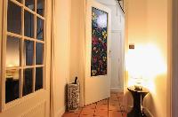 entrance with colorfully designed door in a 3-bedroom Paris luxury apartment