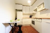 separated kitchen in a 3-bedroom Paris luxury apartment