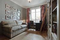 study room with a sofa bed in a 3-bedroom Paris luxury apartment