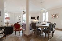charming 3-bedroom Paris luxury apartment with a large living and dining area with an open kitchen