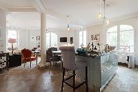 charming 3-bedroom Paris luxury apartment with a large living and dining area with an open kitchen