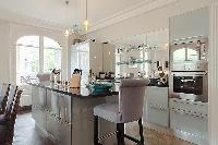 charming 3-bedroom Paris luxury apartment with a large living and dining area with an open kitchen