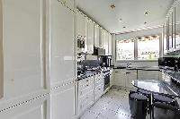 modern kitchen appliances in Trocadéro - Poincaré 3 Bedrooms II luxury apartment