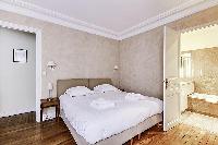 Master Bedroom with a Queen size bed, plenty of closet space, and an en-suite bathroom composed of a