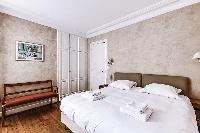 Master Bedroom with a Queen size bed, plenty of closet space, and an en-suite bathroom composed of a