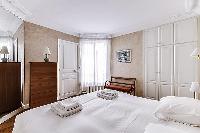 Master Bedroom with a Queen size bed, plenty of closet space, and an en-suite bathroom composed of a