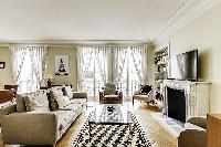 beautifully decorated open living area in a 2-bedroom Paris luxury apartment