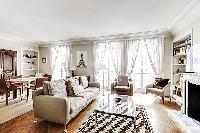 beautifully decorated open living area in a 2-bedroom Paris luxury apartment