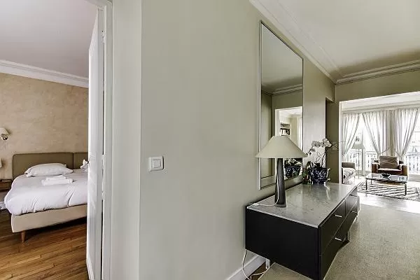 living area and bedroom in Paris luxury apartment