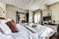 perky and pleasant bedroom of Louvre Palais Royal IV luxury apartment