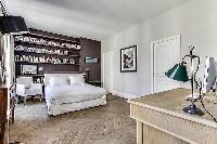 spacious master bedroom of Notre Dame - Lemoine luxury apartment
