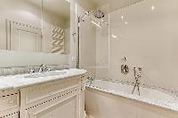 elegant bathroom with tub in Notre Dame - Lemoine luxury apartment