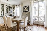 cool dining room with balcony at Notre Dame - Lemoine luxury apartment