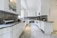 fully equipped modern kitchen in a 3-bedroom Paris luxury apartment