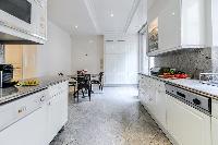 fully equipped modern kitchen in a 3-bedroom Paris luxury apartment