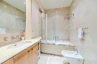 full bathroom with a toilet in a 3-bedroom Paris luxury apartment