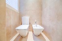 full bathroom with a toilet in a 3-bedroom Paris luxury apartment