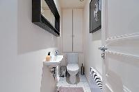 a separate toilet in a 2-bedroom paris luxury apartment