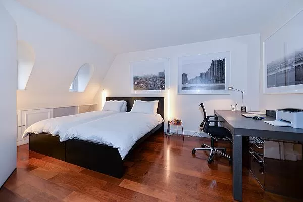 lovely bedroom with 2 single beds, study table, and parquet floor elegantly designed 2-bedroom paris