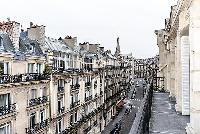 view from the balcony overlooking the city in paris luxury apartment