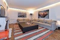 elegant living room with comfortable furniture, modern furnishings, and beautiful carpetry  in paris